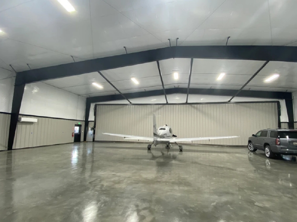 Wide-span steel aircraft hangars in Toronto with bifold or sliding doors
