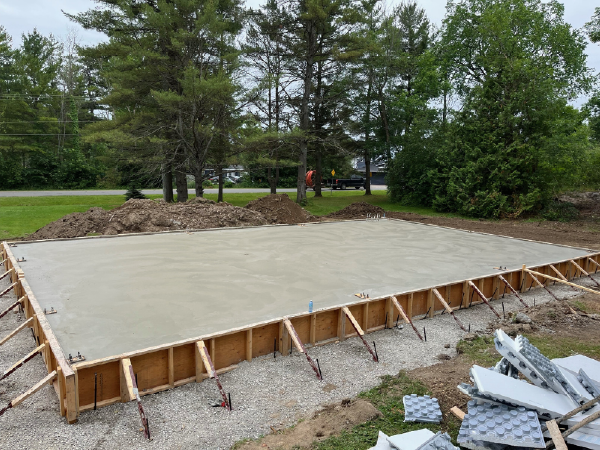 Concrete slab and pier installation for steel buildings in Toronto