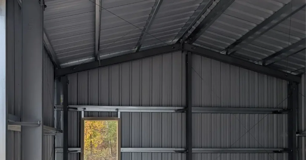 Interior of a prefab steel building in Ontario by Tower Steel Buildings showing strong framing, clear span design, and durability