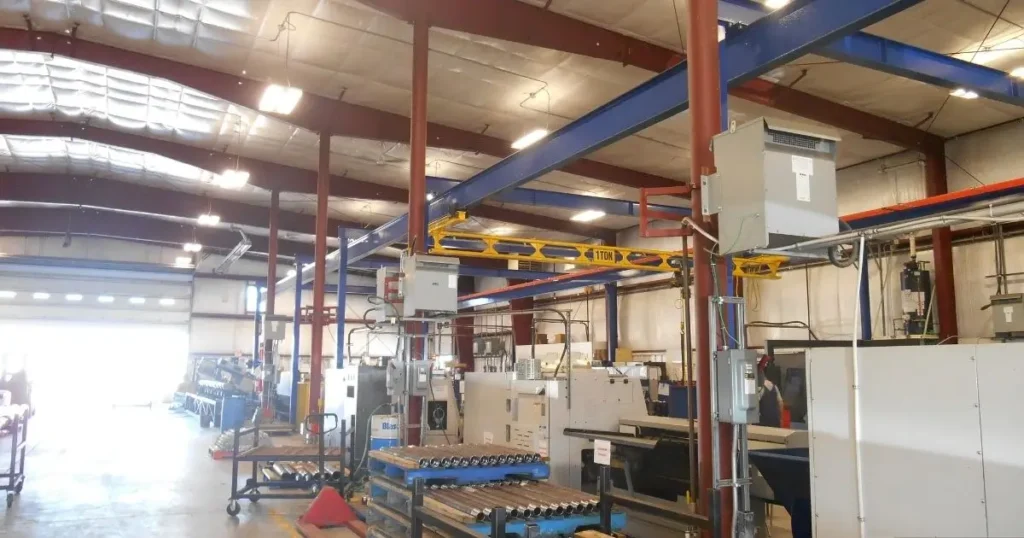 Interior of a steel manufacturing facility in Ontario showing metal framing, insulation, and heavy machinery setup