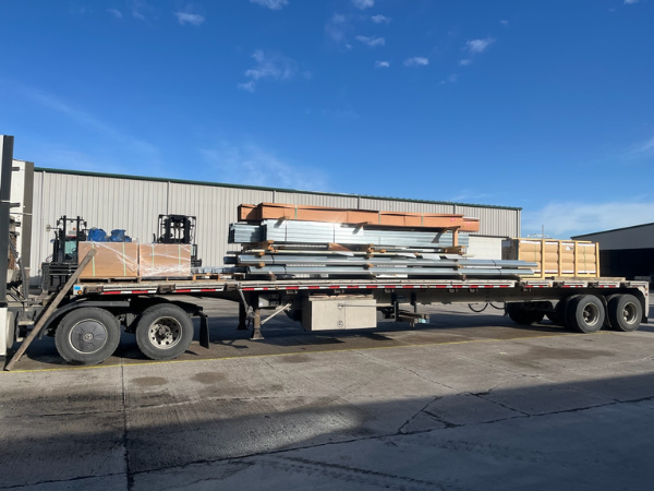 Pre-engineered steel building components staged for delivery in Orillia Ontario
