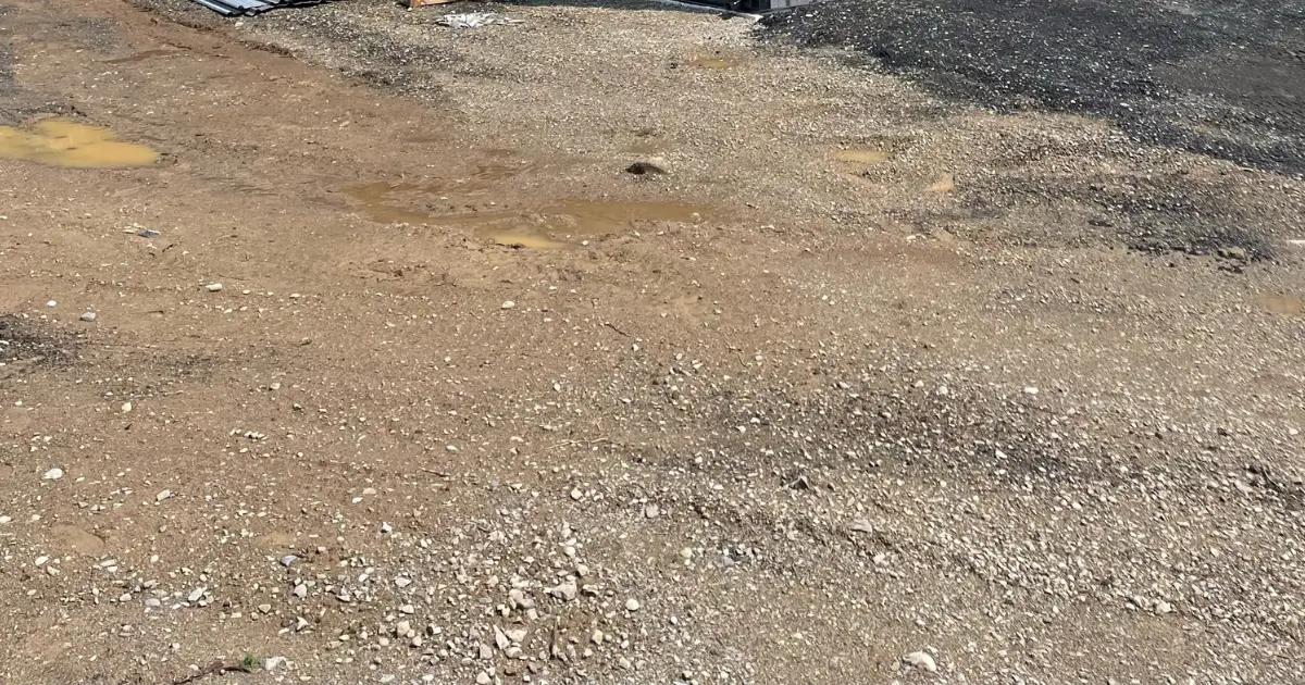 Soil conditions at a Canadian construction site showing mixed granular and compacted soils that influence steel building foundation design and drainage planning.