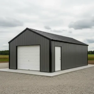 30x30x12 steel garage building with vertical metal siding, overhead garage door and side entry door installed on concrete slab foundation