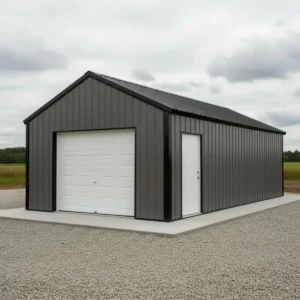 Front 3/4 perspective site-installed 30x40x16 heavy duty prefabricated clear-span steel garage with charcoal ribbed steel panels gable roof and white sectional overhead door