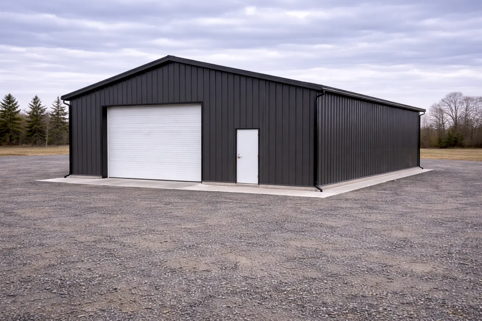 30x50x14 contractor steel workshop front elevation with large overhead service door and symmetrical gable roof structure.