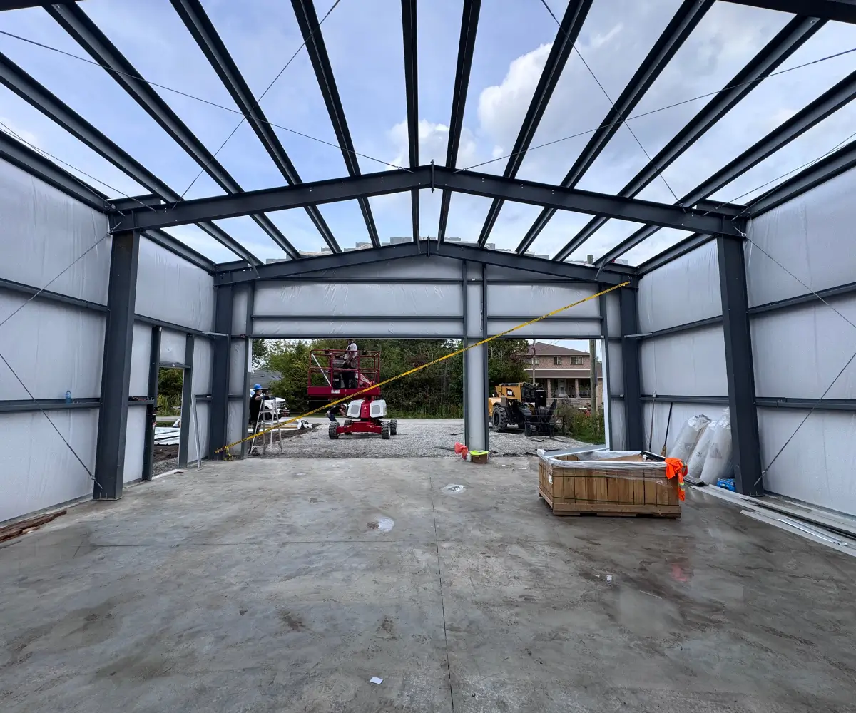 Interior steel building structure showing load transfer from roof to foundation system