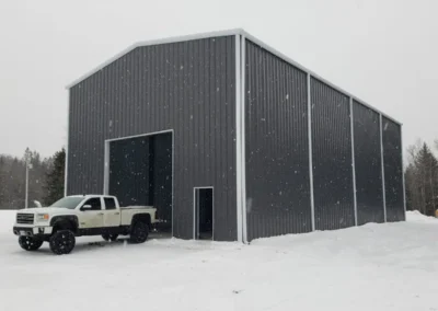 Steel workshop building in Ontario showing site access and servicing conditions affecting permit approval